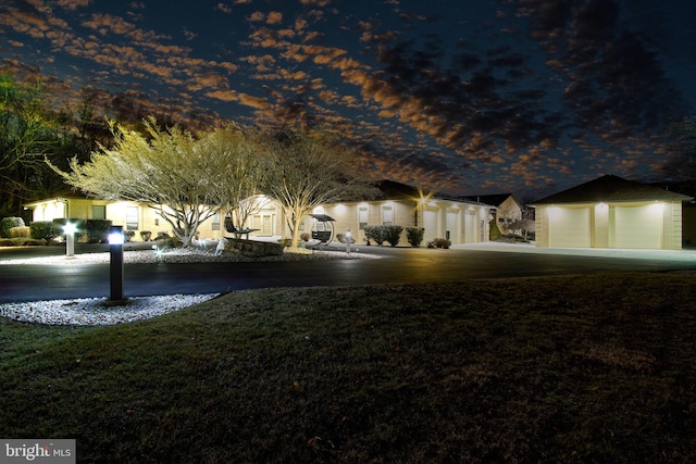 view of yard at twilight