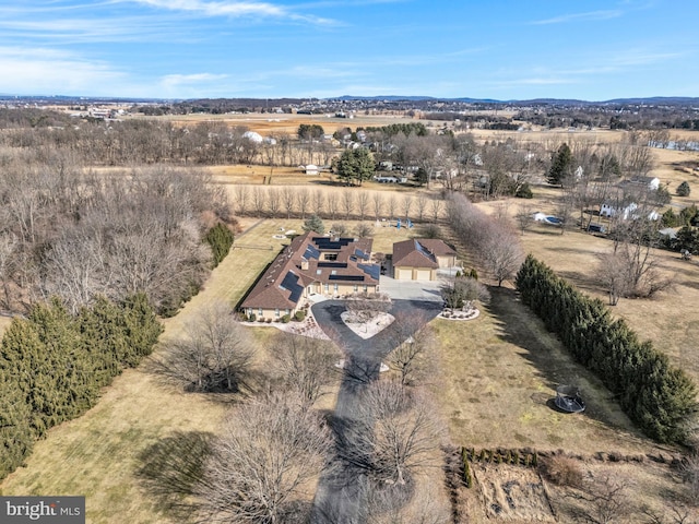 birds eye view of property with a rural view