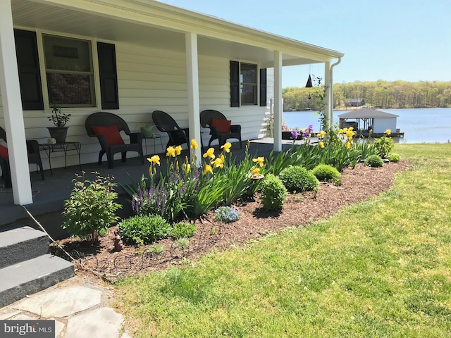 exterior space featuring a water view and covered porch