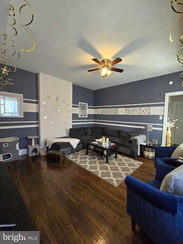 living room with a ceiling fan and wood finished floors