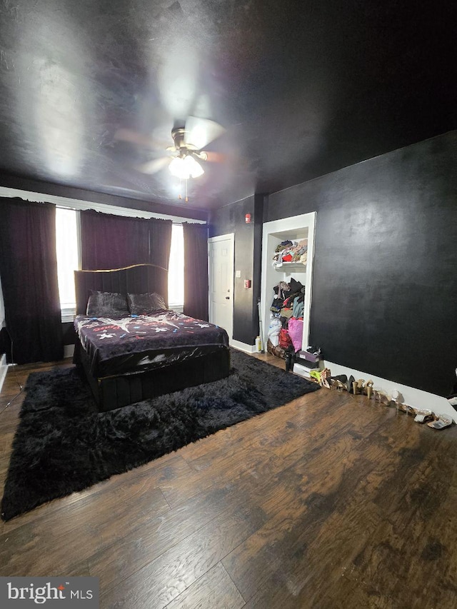 bedroom featuring ceiling fan and wood finished floors