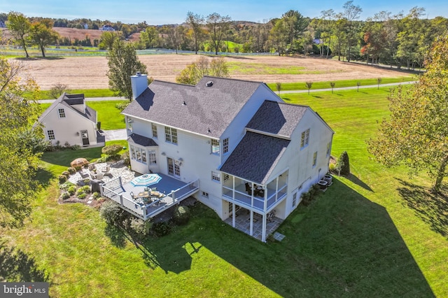 birds eye view of property featuring a rural view