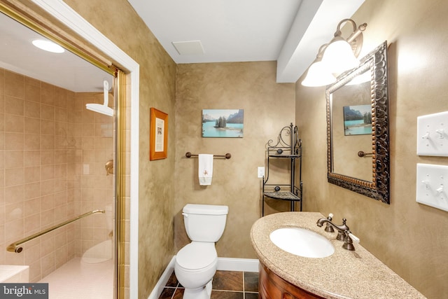 bathroom featuring baseboards, toilet, a stall shower, tile patterned floors, and vanity