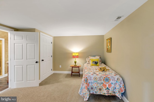 bedroom with visible vents, baseboards, and carpet