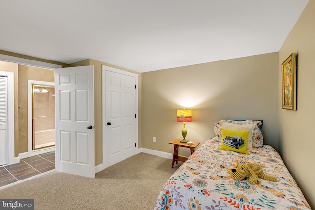 carpeted bedroom with baseboards