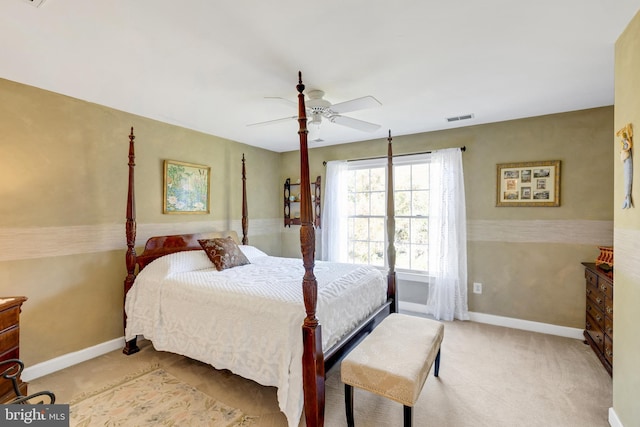 carpeted bedroom featuring visible vents, baseboards, and a ceiling fan