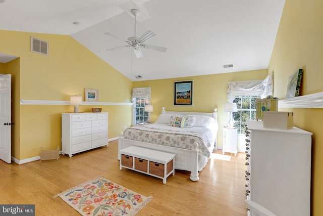 bedroom featuring lofted ceiling, visible vents, and light wood finished floors