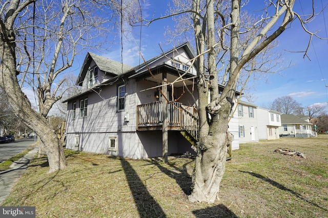 view of home's exterior with a lawn