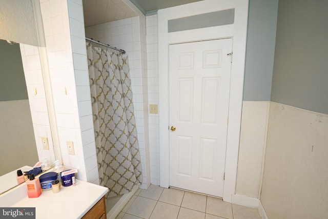 bathroom with a shower with curtain, tile patterned flooring, and vanity