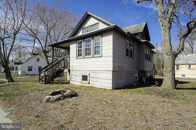 view of side of home featuring central AC unit