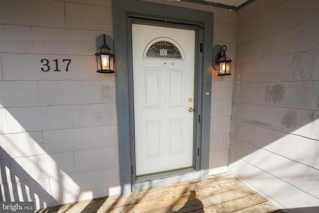 entrance to property with concrete block siding