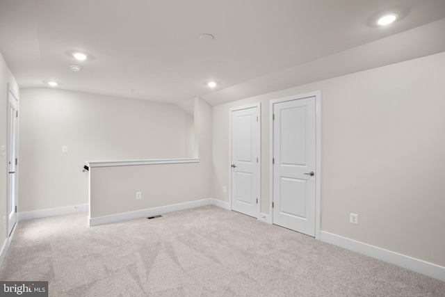 below grade area with carpet, visible vents, baseboards, and recessed lighting