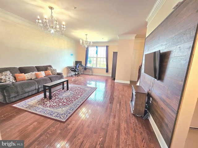 living room with baseboards, a chandelier, hardwood / wood-style floors, and ornamental molding