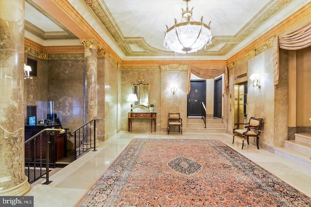 hallway featuring a chandelier, crown molding, stairway, a raised ceiling, and ornate columns