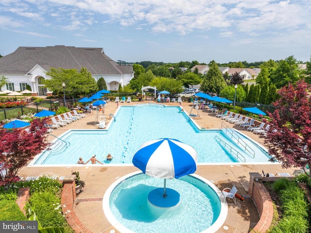 pool featuring a patio and fence