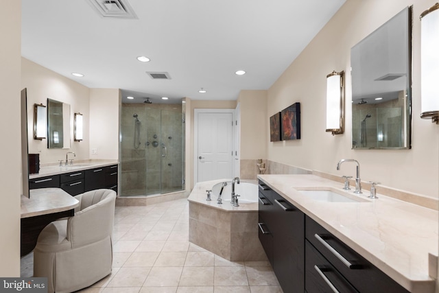 full bath featuring a stall shower, a sink, and visible vents