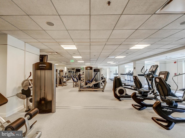 exercise room with a paneled ceiling