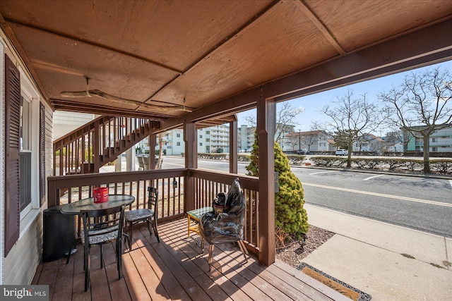 wooden terrace featuring stairs