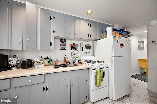 kitchen featuring marble finish floor, white appliances, and gray cabinets