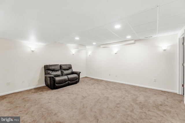 unfurnished room with visible vents, a drop ceiling, recessed lighting, carpet, and baseboards