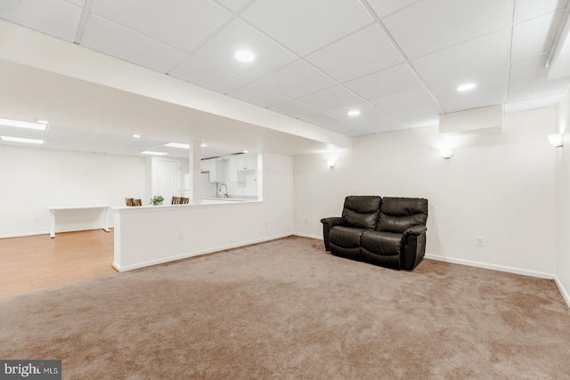 unfurnished room featuring recessed lighting, baseboards, a paneled ceiling, and carpet