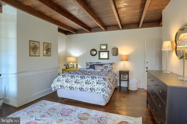 bedroom featuring beamed ceiling, wooden ceiling, dark wood finished floors, and baseboards