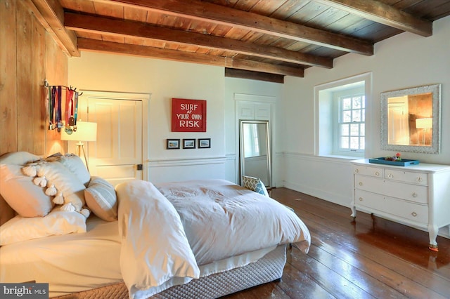 bedroom featuring wood ceiling, beamed ceiling, and dark wood-style flooring