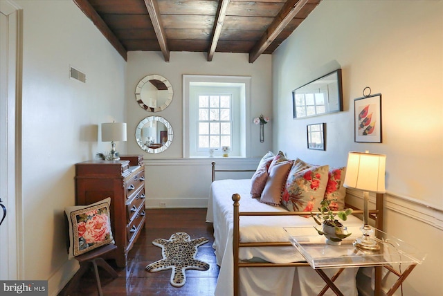 interior space with wooden ceiling, visible vents, dark wood finished floors, and beam ceiling