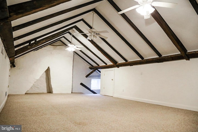 bonus room featuring vaulted ceiling with beams, carpet flooring, and a ceiling fan