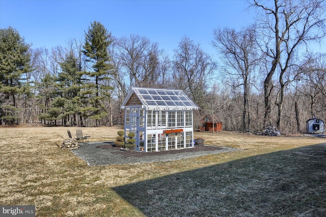 view of yard with an exterior structure and an outdoor structure