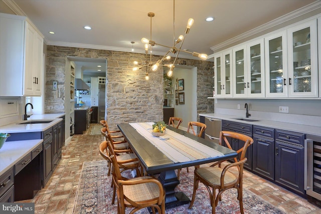 dining space with ornamental molding, recessed lighting, brick floor, and wine cooler