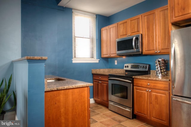 kitchen featuring brown cabinets and stainless steel appliances