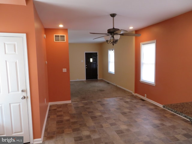 foyer featuring baseboards, visible vents, ceiling fan, and recessed lighting