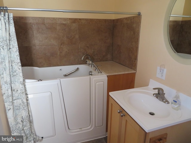 full bath with a tub, a shower with curtain, and vanity