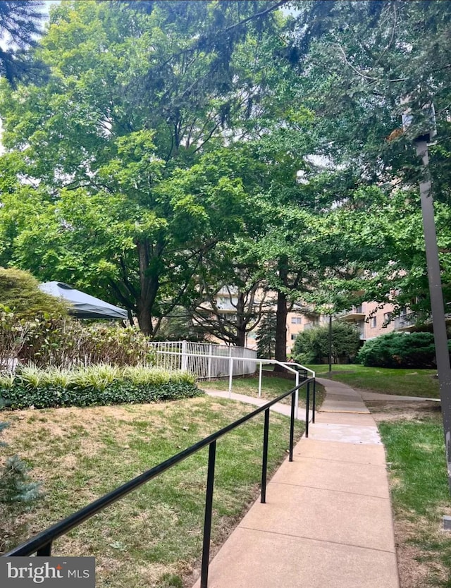 view of home's community featuring fence