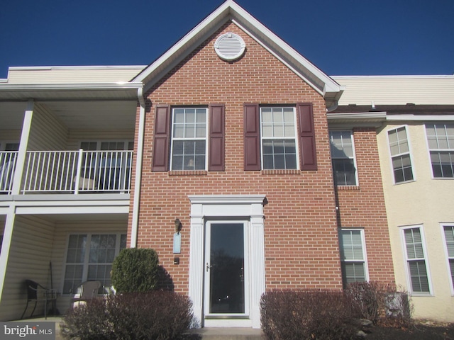 view of property with brick siding