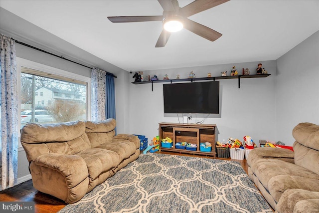 living room featuring ceiling fan and wood finished floors