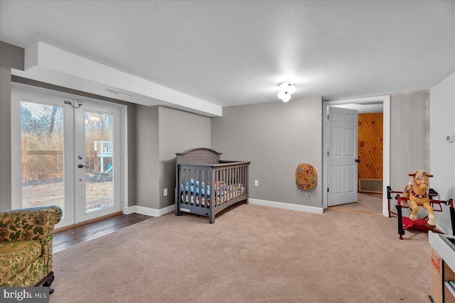 carpeted bedroom featuring access to outside, french doors, and baseboards