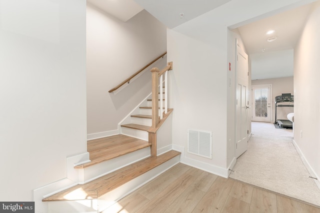 153 Glory Maple Ln, Downingtown, PA 19335 - stairway featuring wood finished floors, visible vents, and baseboards