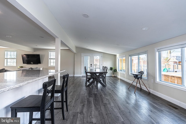 dining space featuring a wealth of natural light, visible vents, dark wood-type flooring, and french doors