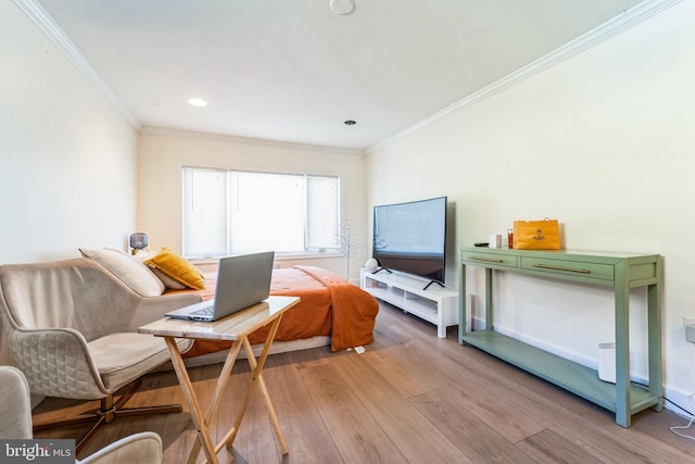 interior space featuring crown molding and light wood finished floors