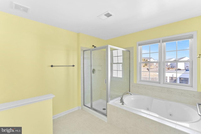 bathroom featuring a jetted tub, a shower stall, and visible vents