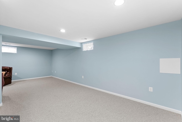 basement with recessed lighting, carpet flooring, visible vents, and baseboards