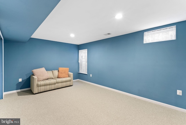 living area featuring carpet floors, recessed lighting, visible vents, and baseboards