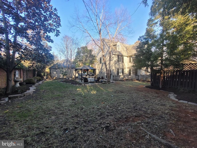 view of yard with a gazebo and fence