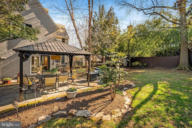 view of yard featuring a gazebo, a patio area, and fence