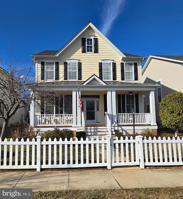 view of front of house with a porch and a fenced front yard