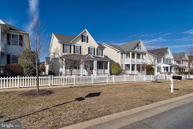 view of front of house featuring a fenced front yard and a residential view