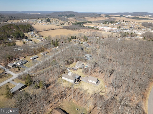 birds eye view of property with a rural view