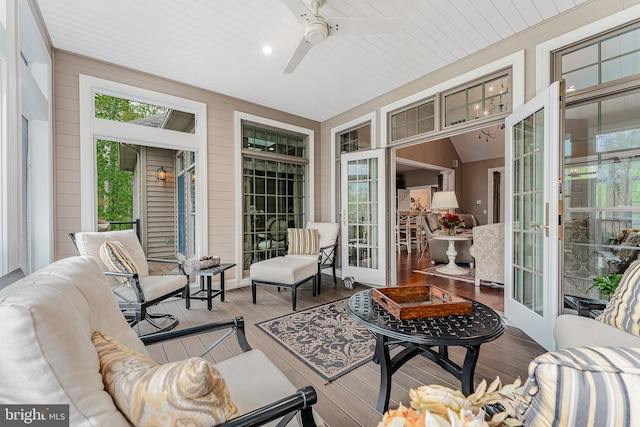 sunroom / solarium featuring ceiling fan